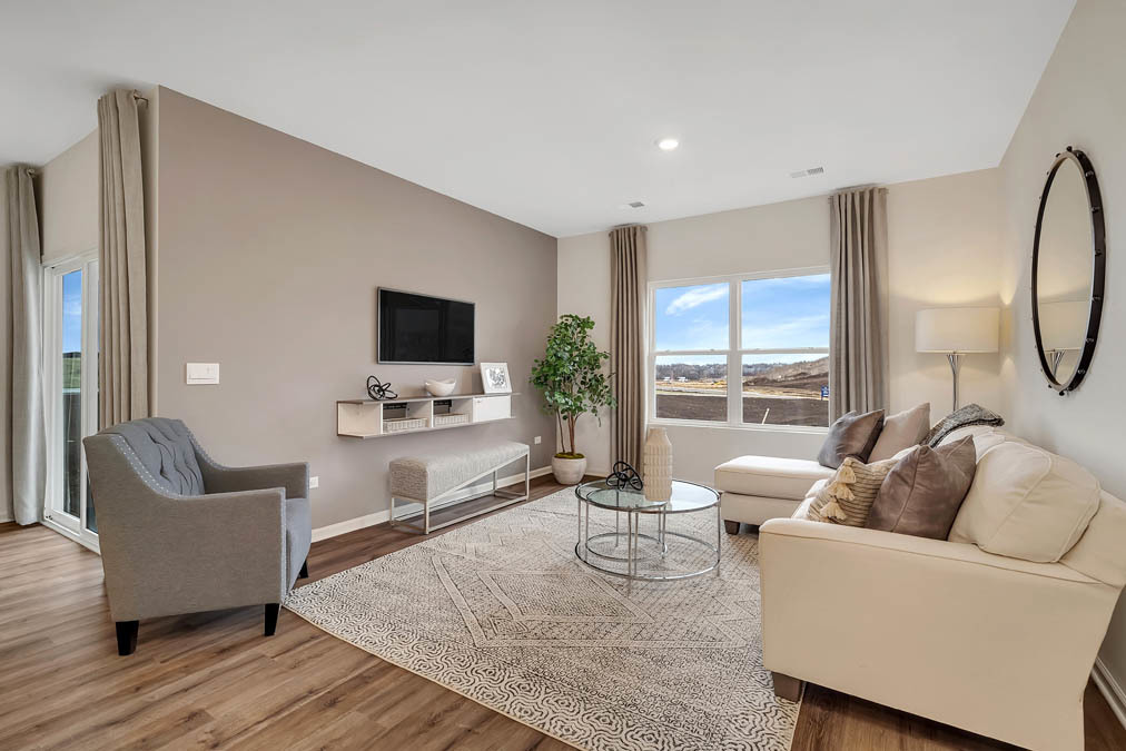 1122 Bluebell Lane Bartlett, IL 60103 - Photo 8 of 15 a living room with furniture and a flat screen tv
