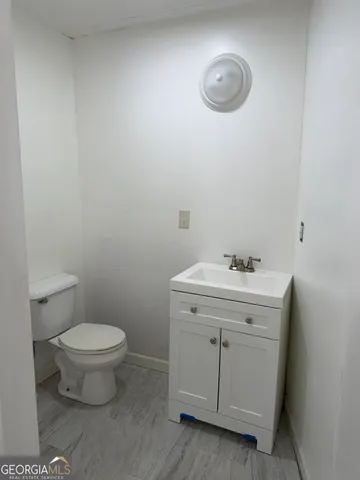 a bathroom with a sink and a toilet