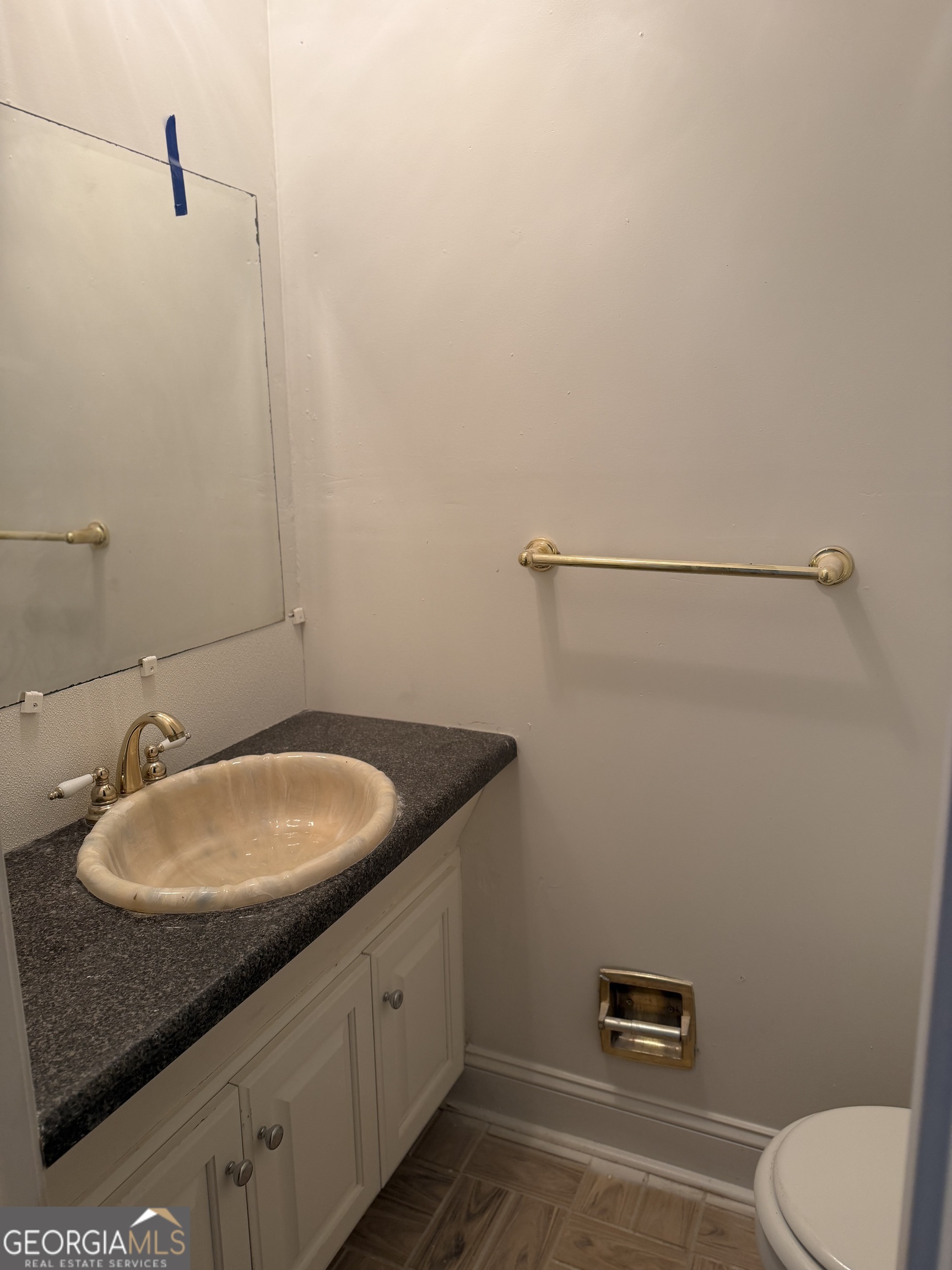153 Wheehaw Road Macon, GA 31211 - Photo 15 of 28 a bathroom with a granite countertop sink and mirror