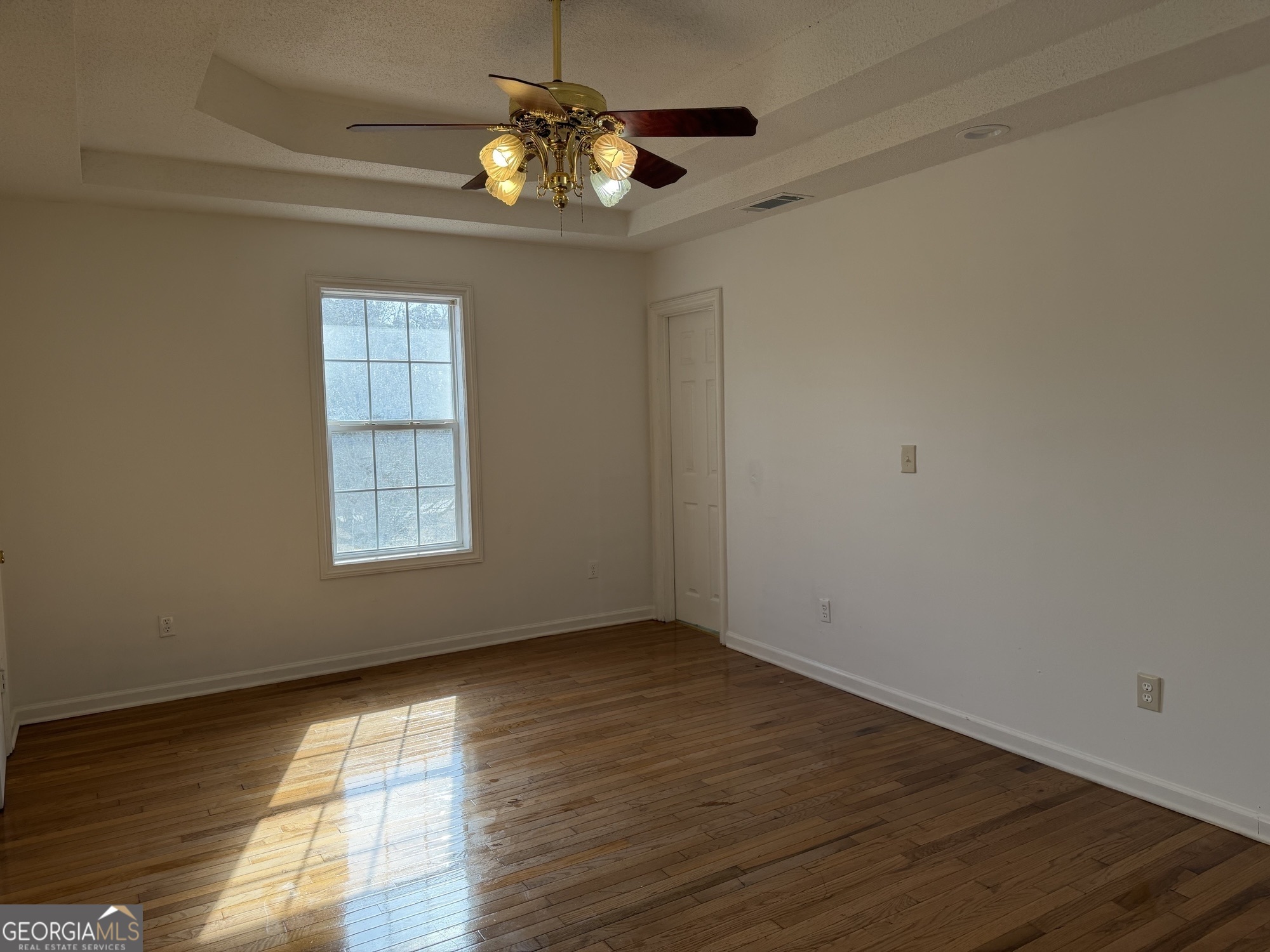153 Wheehaw Road Macon, GA 31211 - Photo 16 of 28 wooden floor in an empty room with a window