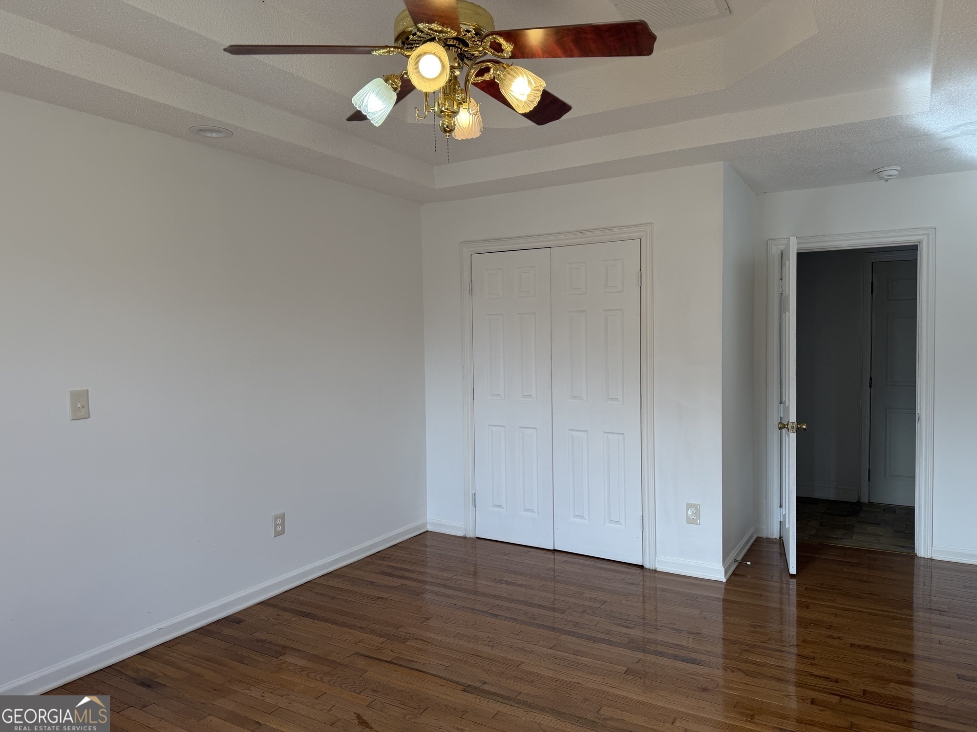 153 Wheehaw Road Macon, GA 31211 - Photo 17 of 28 a view of an empty room with wooden floor and windows