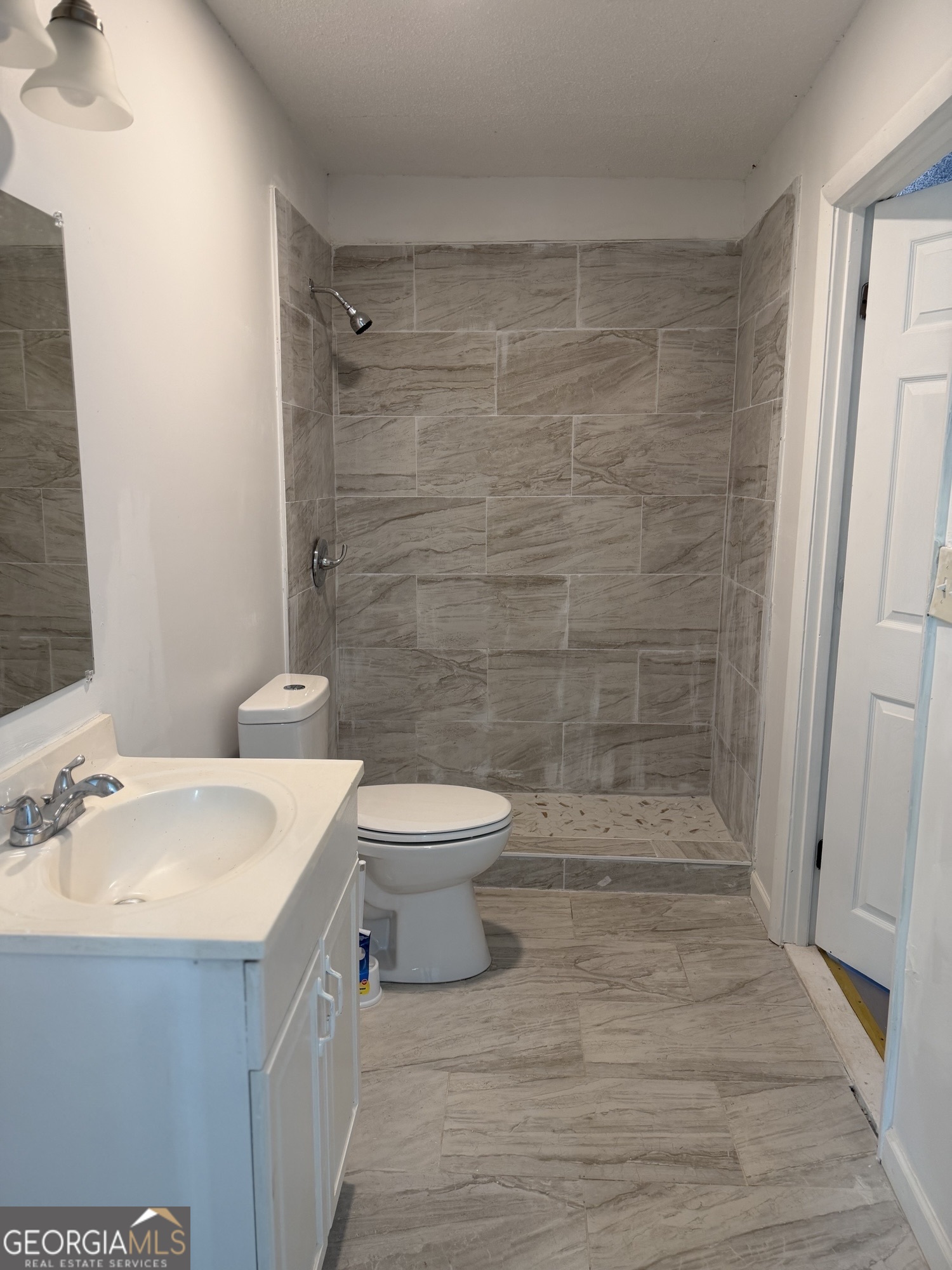 153 Wheehaw Road Macon, GA 31211 - Photo 20 of 28 a bathroom with a sink a toilet and shower