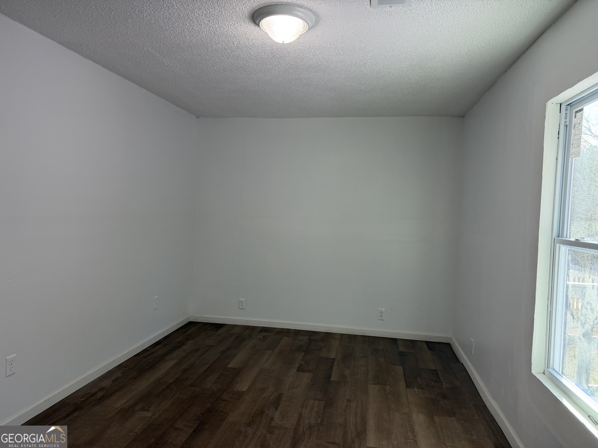 153 Wheehaw Road Macon, GA 31211 - Photo 21 of 28 a view of an empty room and window