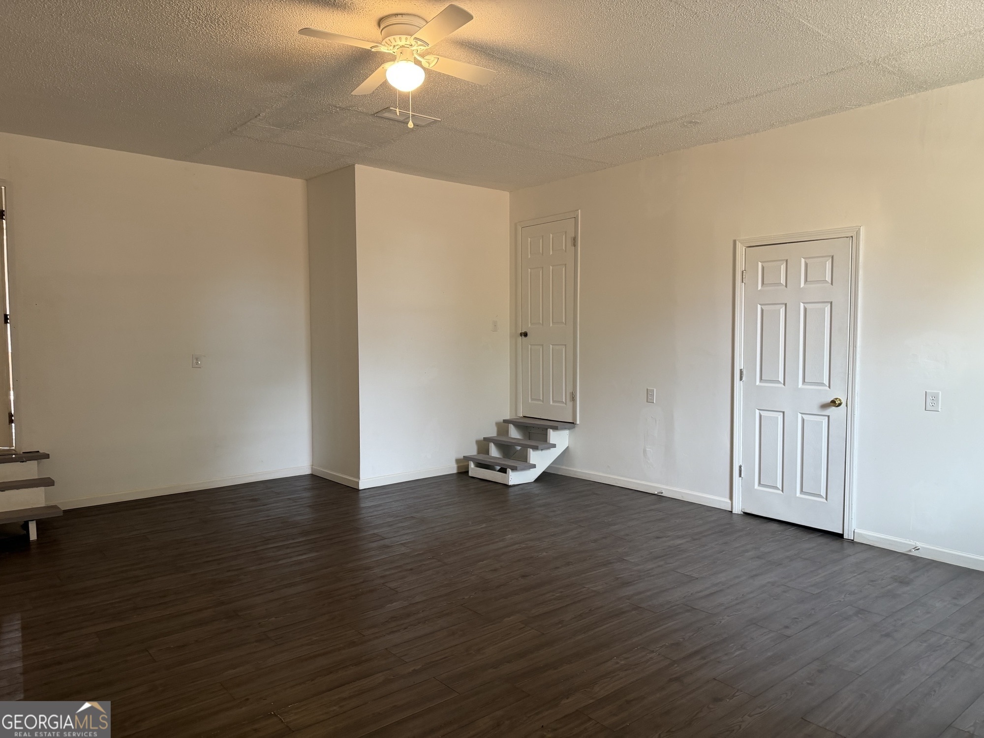 153 Wheehaw Road Macon, GA 31211 - Photo 22 of 28 a view of an empty room with wooden floor