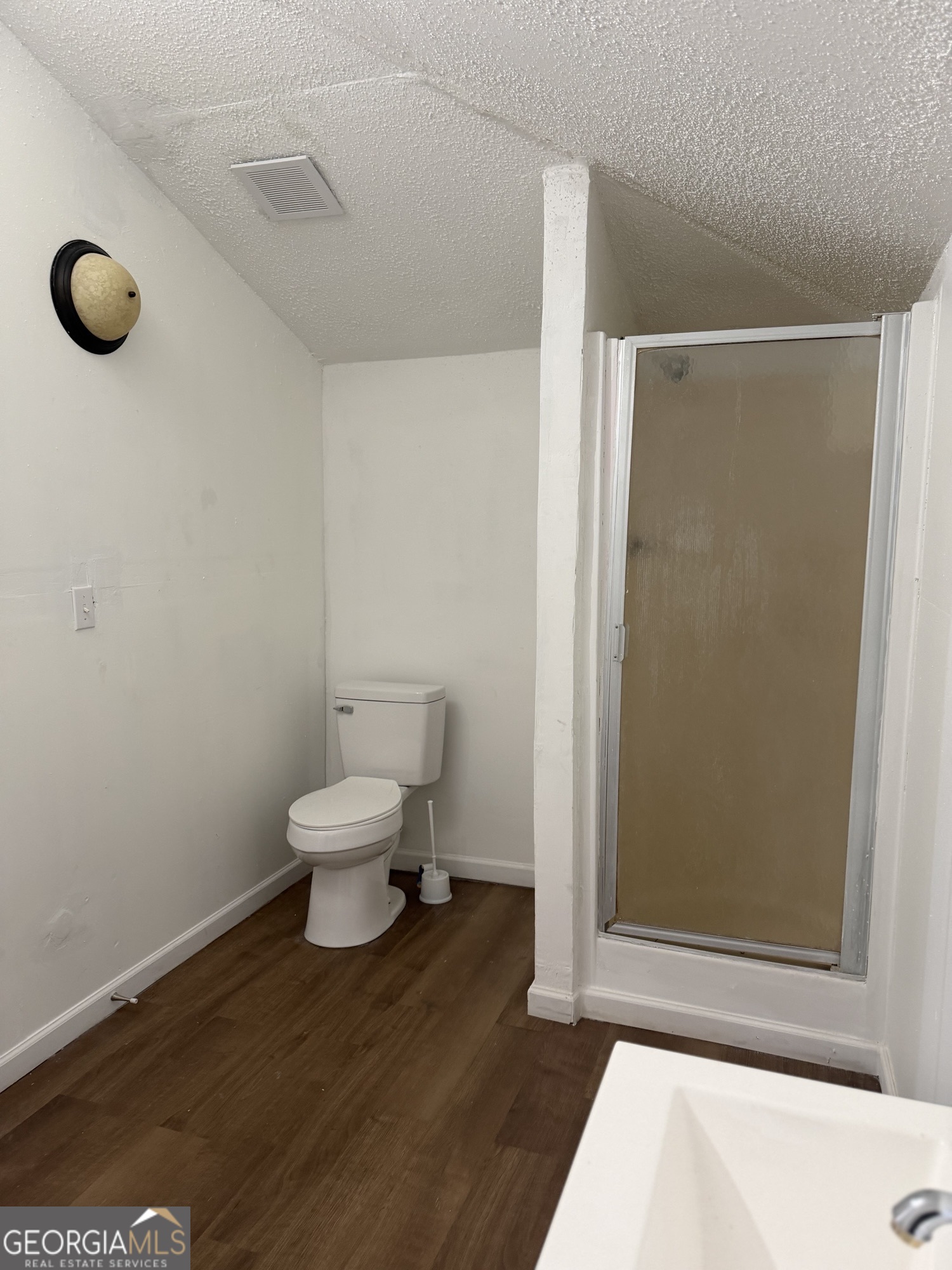 153 Wheehaw Road Macon, GA 31211 - Photo 26 of 28 a bathroom with a toilet and a shower