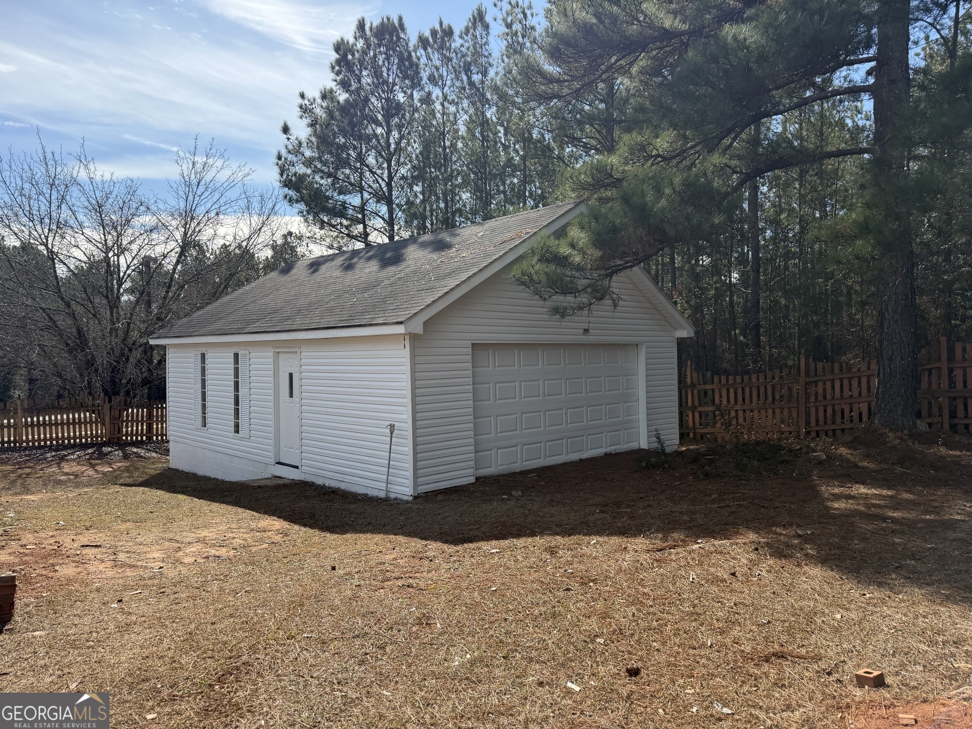153 Wheehaw Road Macon, GA 31211 - Photo 27 of 28 a view of a house with a yard and garage