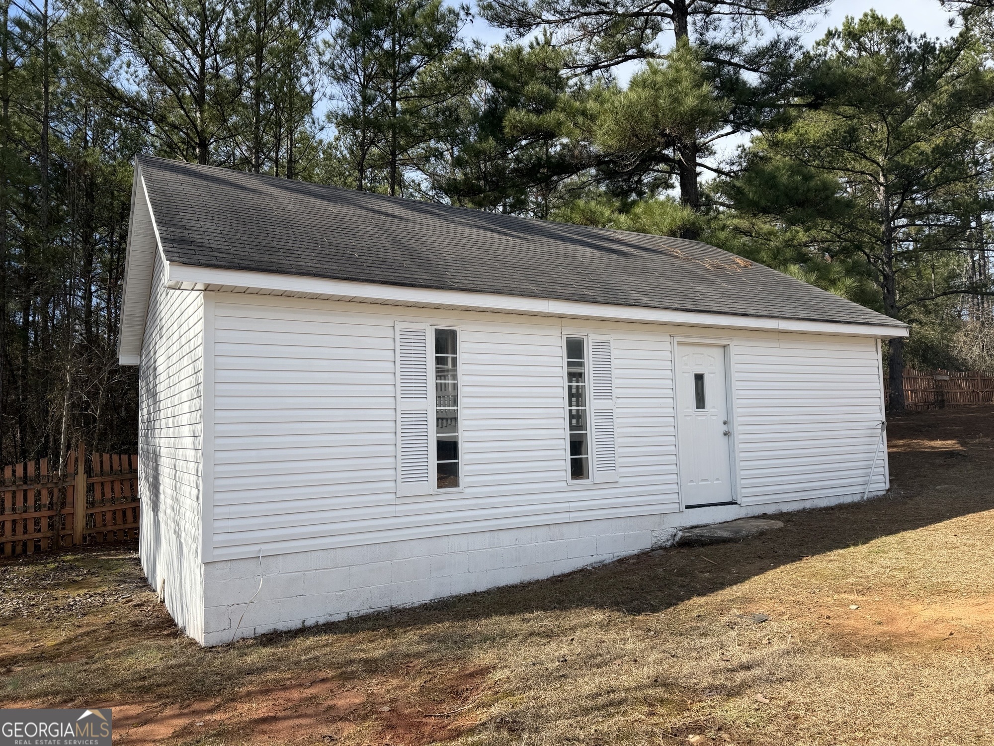 153 Wheehaw Road Macon, GA 31211 - Photo 28 of 28 a view of a white house with large trees