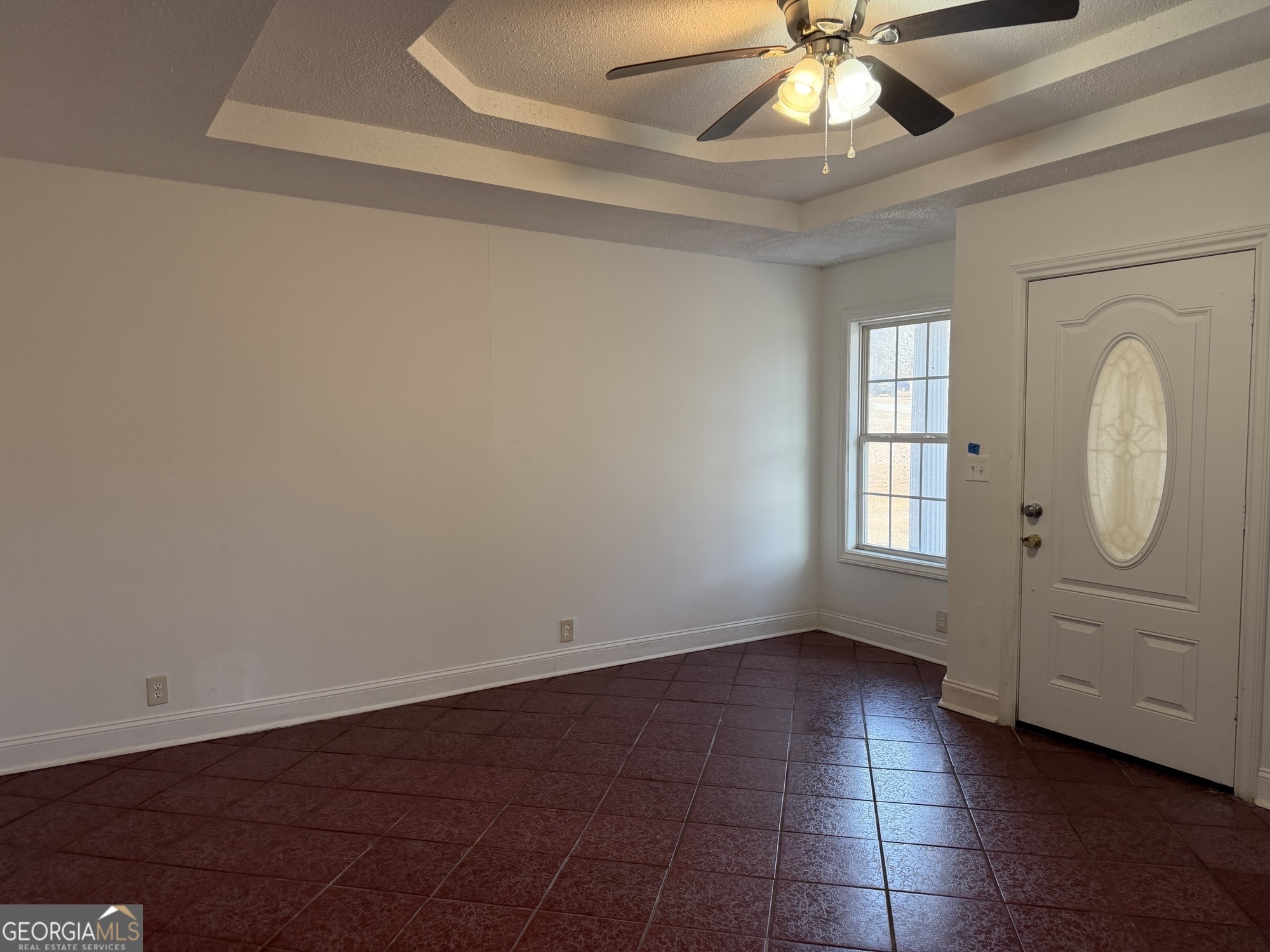 153 Wheehaw Road Macon, GA 31211 - Photo 9 of 28 an empty room with windows and fan