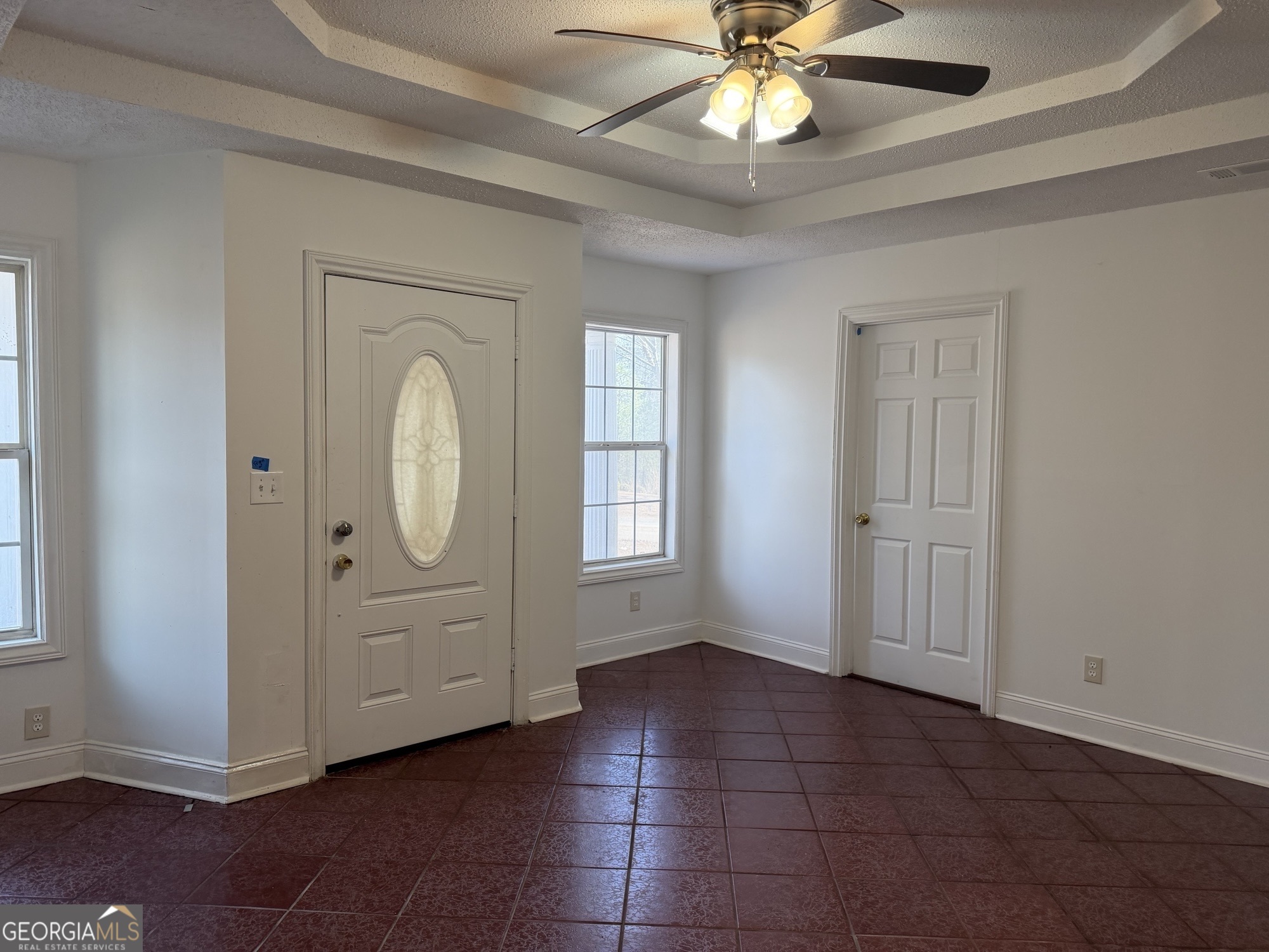 153 Wheehaw Road Macon, GA 31211 - Photo 10 of 28 an empty room with windows and fan