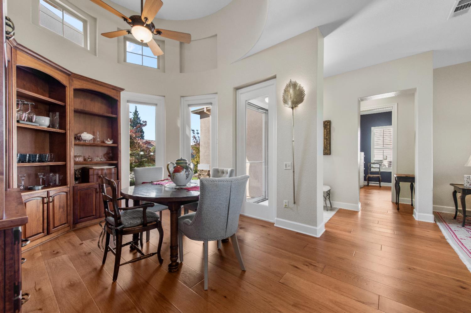 1146 Secret Lake Loop Lincoln, CA 95648 - Photo 12 of 61 a view of a dining room with furniture and wooden floor