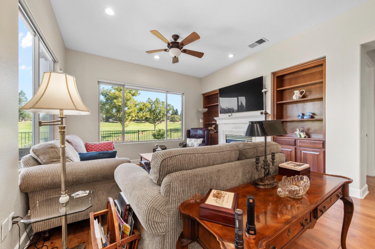 1146 Secret Lake Loop Lincoln, CA 95648 - Photo 18 of 61 a living room with furniture a large window and a flat screen tv