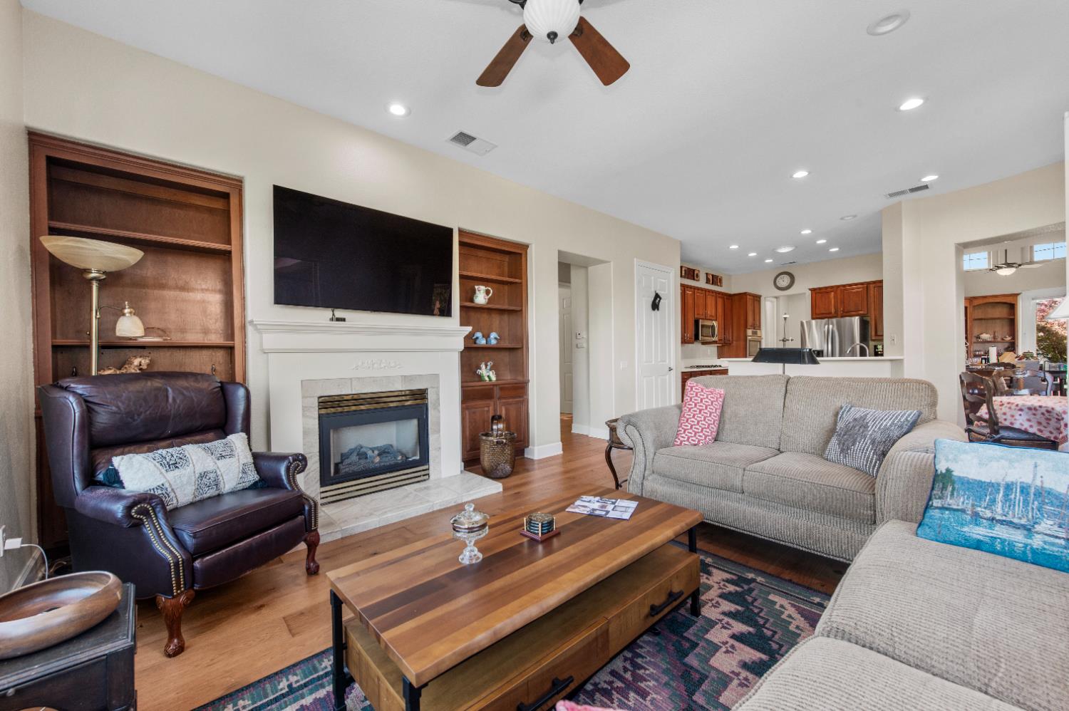 1146 Secret Lake Loop Lincoln, CA 95648 - Photo 20 of 61 a living room with furniture fireplace and flat screen tv