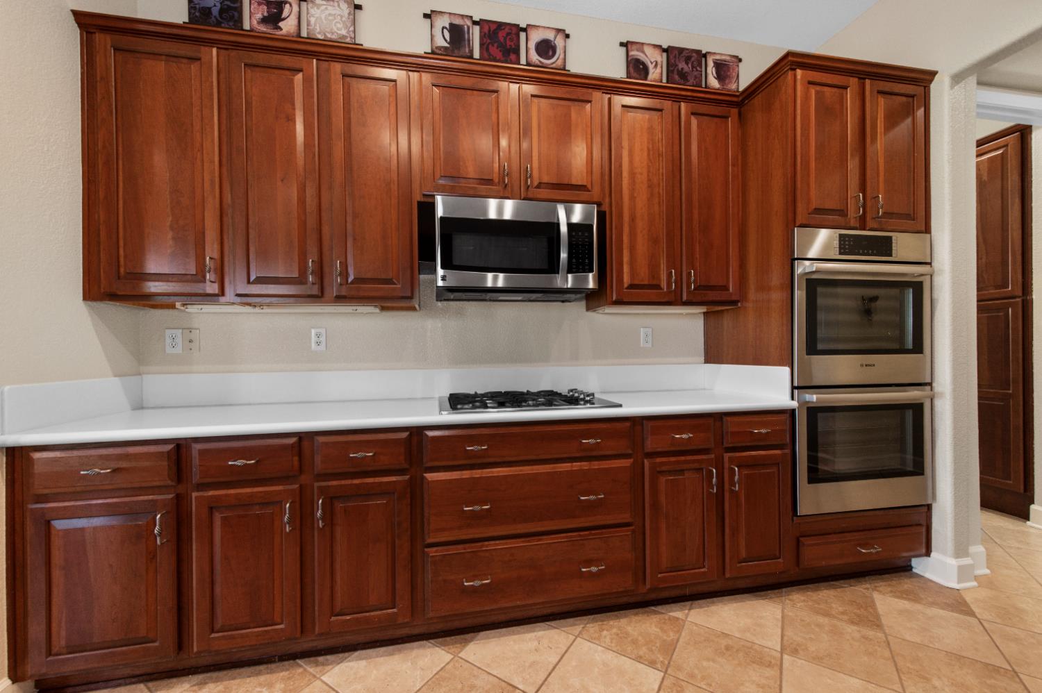 1146 Secret Lake Loop Lincoln, CA 95648 - Photo 31 of 61 a kitchen with granite countertop wooden cabinets and stainless steel appliances
