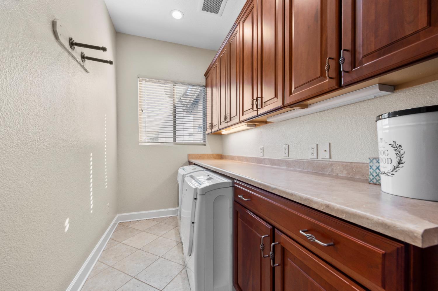 1146 Secret Lake Loop Lincoln, CA 95648 - Photo 37 of 61 a kitchen with stainless steel appliances granite countertop a sink a stove and cabinets