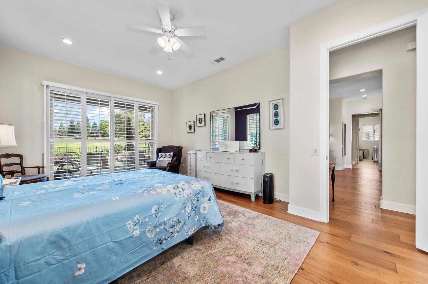 1146 Secret Lake Loop Lincoln, CA 95648 - Photo 43 of 61 a bedroom with a large bed and a chandelier