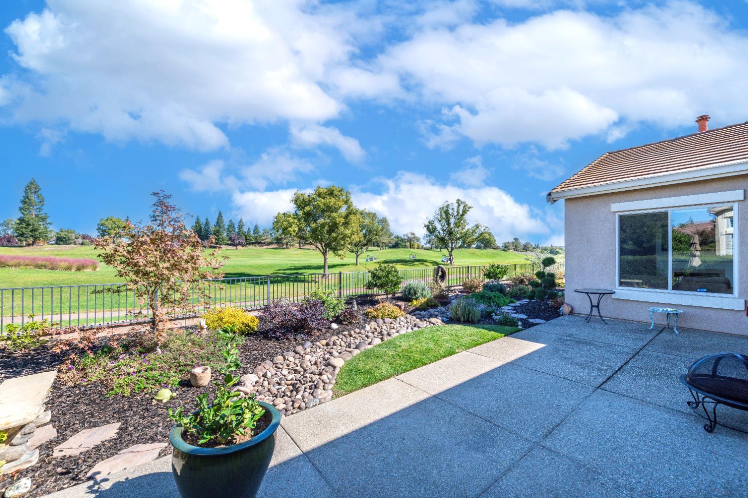1146 Secret Lake Loop Lincoln, CA 95648 - Photo 52 of 61 a view of a garden with plants and a bench