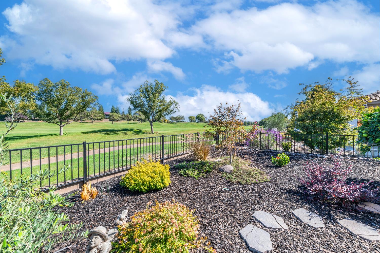 1146 Secret Lake Loop Lincoln, CA 95648 - Photo 57 of 61 a view of a garden with a bench in a garden