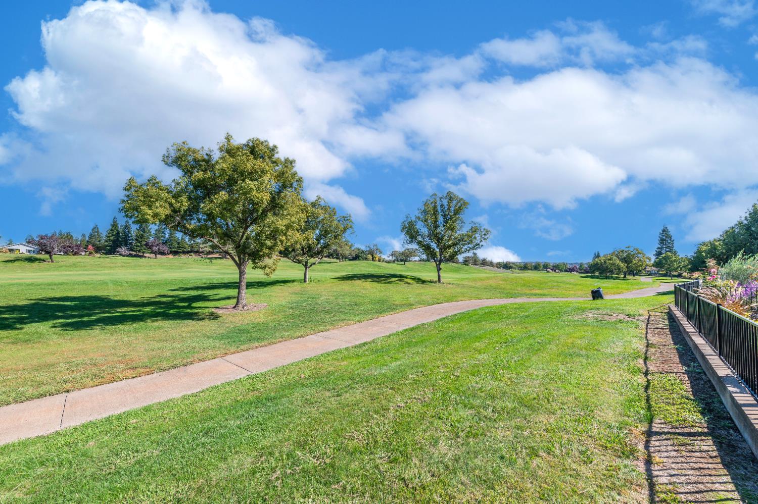 1146 Secret Lake Loop Lincoln, CA 95648 - Photo 59 of 61 a view of a golf course with a lake