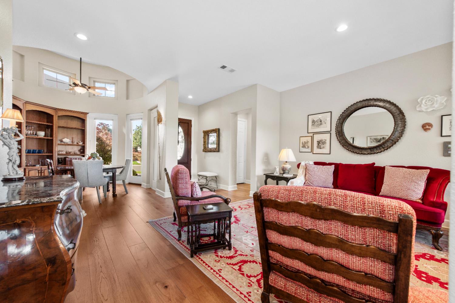 1146 Secret Lake Loop Lincoln, CA 95648 - Photo 8 of 61 a living room with furniture a dining table and wooden floor