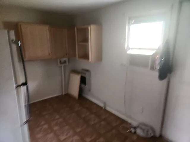 a bathroom with a tub and shower