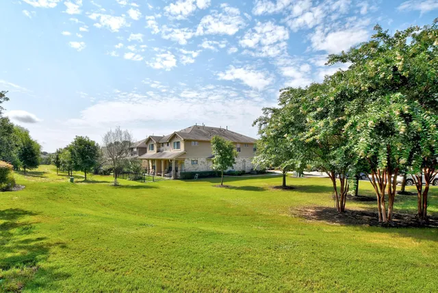 a view of a swimming pool with sitting area