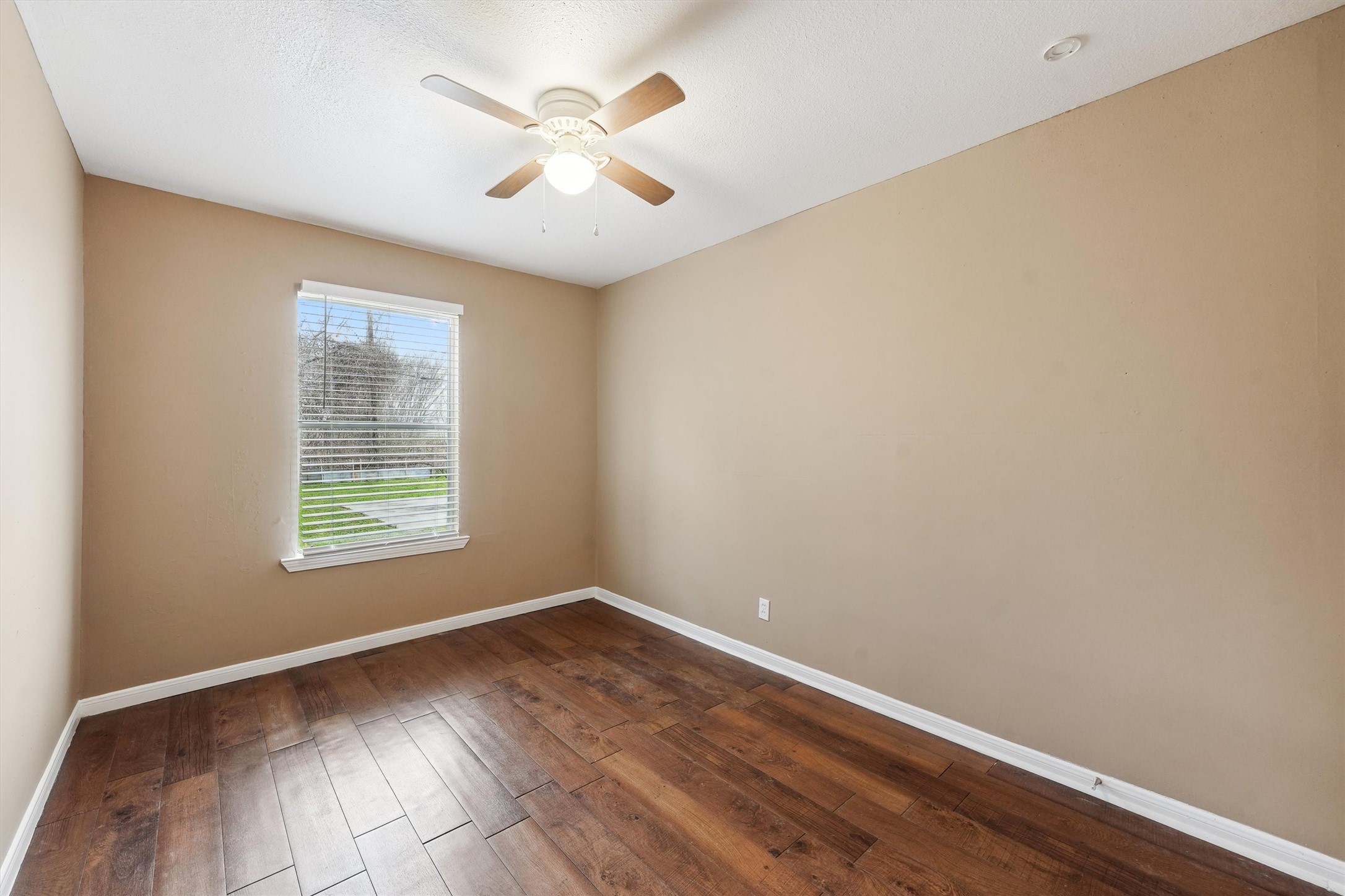 1107 Defender Street Houston, TX 77029 - Photo 15 of 26 an empty room with wooden floor and windows