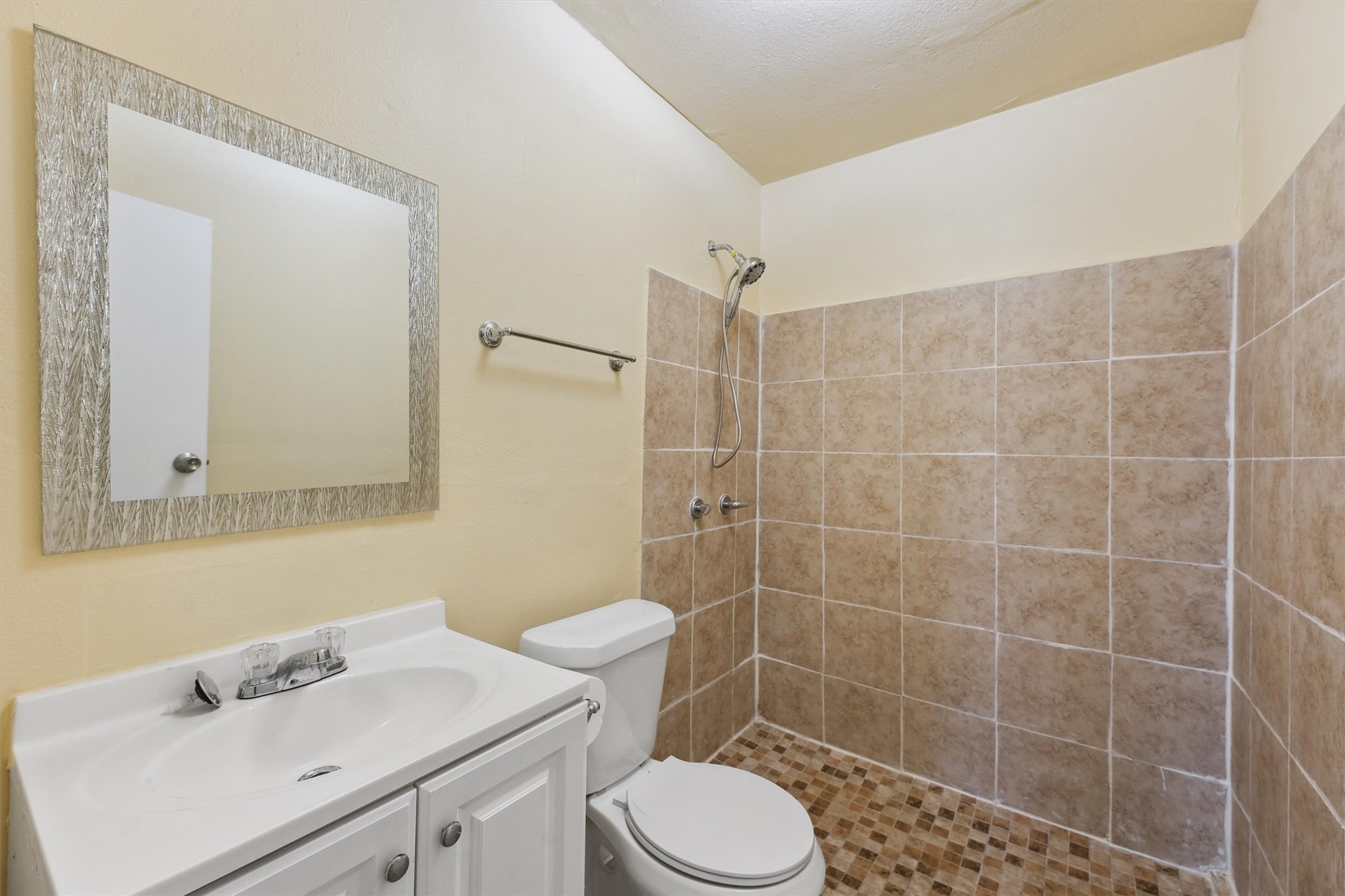 1107 Defender Street Houston, TX 77029 - Photo 23 of 26 a bathroom with a sink toilet and shower