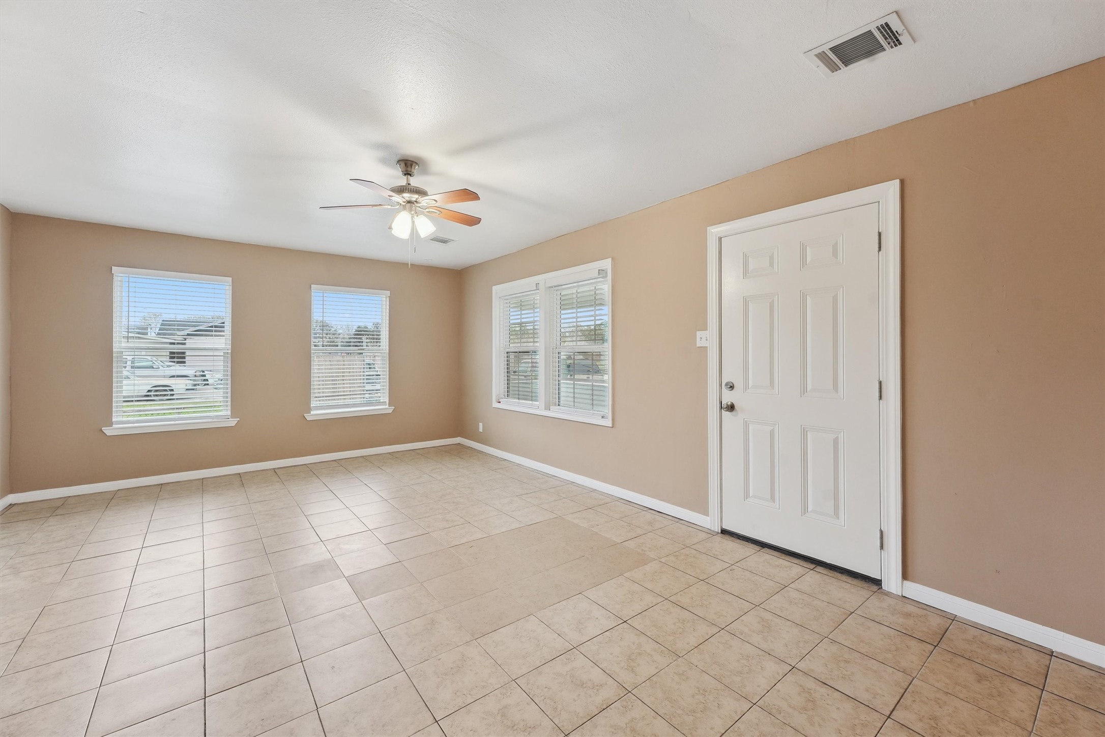 1107 Defender Street Houston, TX 77029 - Photo 6 of 26 a view of an empty room with windows