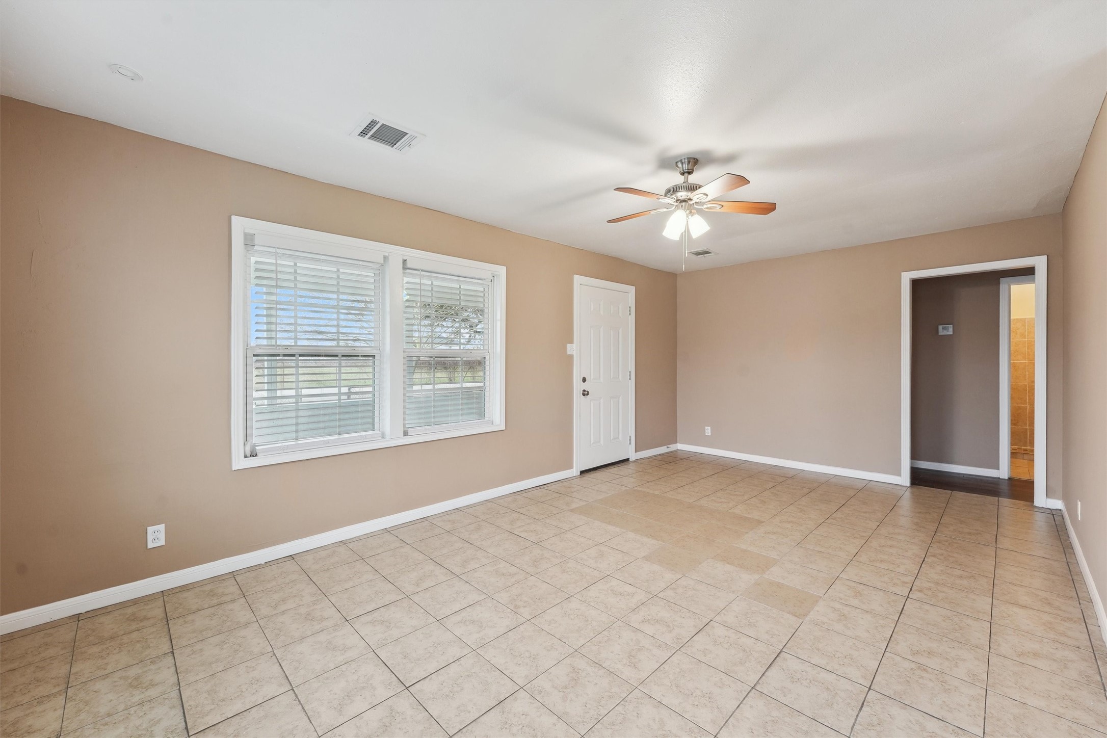 1107 Defender Street Houston, TX 77029 - Photo 8 of 26 a view of an empty room with a window