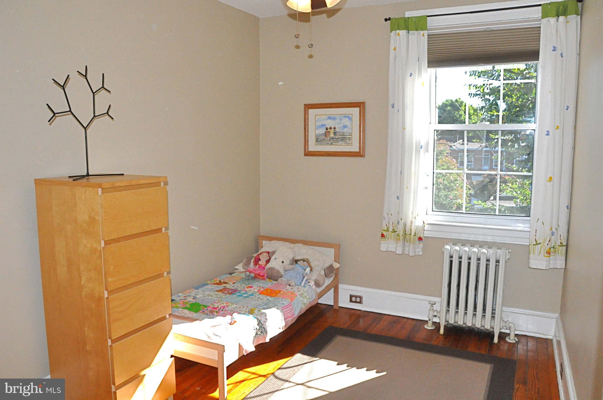 3825 Keswick Road Baltimore, MD 21211 - Photo 22 of 30 a bedroom with a bed and a window