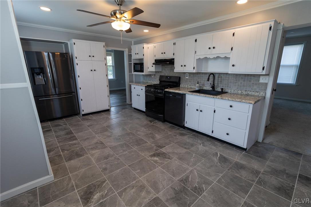 6366 Farm Bureau Road Allentown, PA 18106 - Photo 11 of 36 a large kitchen with a stove a refrigerator and a refrigerator