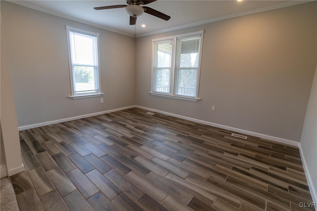 6366 Farm Bureau Road Allentown, PA 18106 - Photo 14 of 36 wooden floor in an empty room with a window