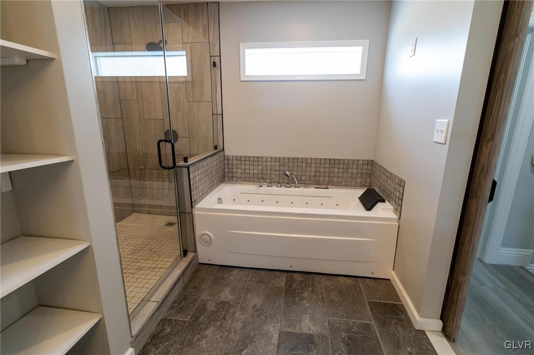 6366 Farm Bureau Road Allentown, PA 18106 - Photo 17 of 36 a bathroom with a bathtub and toilet