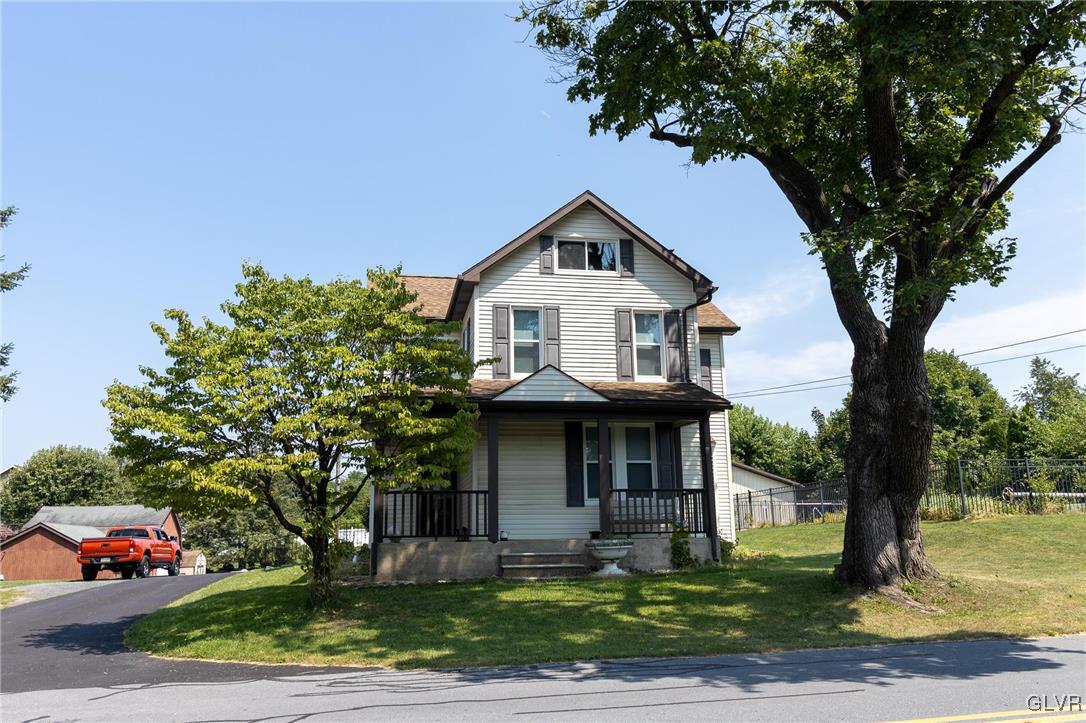 6366 Farm Bureau Road Allentown, PA 18106 - Photo 2 of 36 a front view of a house with garden