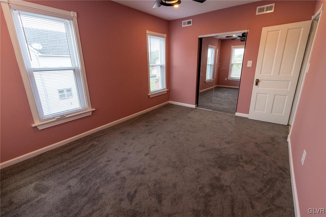 6366 Farm Bureau Road Allentown, PA 18106 - Photo 21 of 36 an empty room with windows and closet