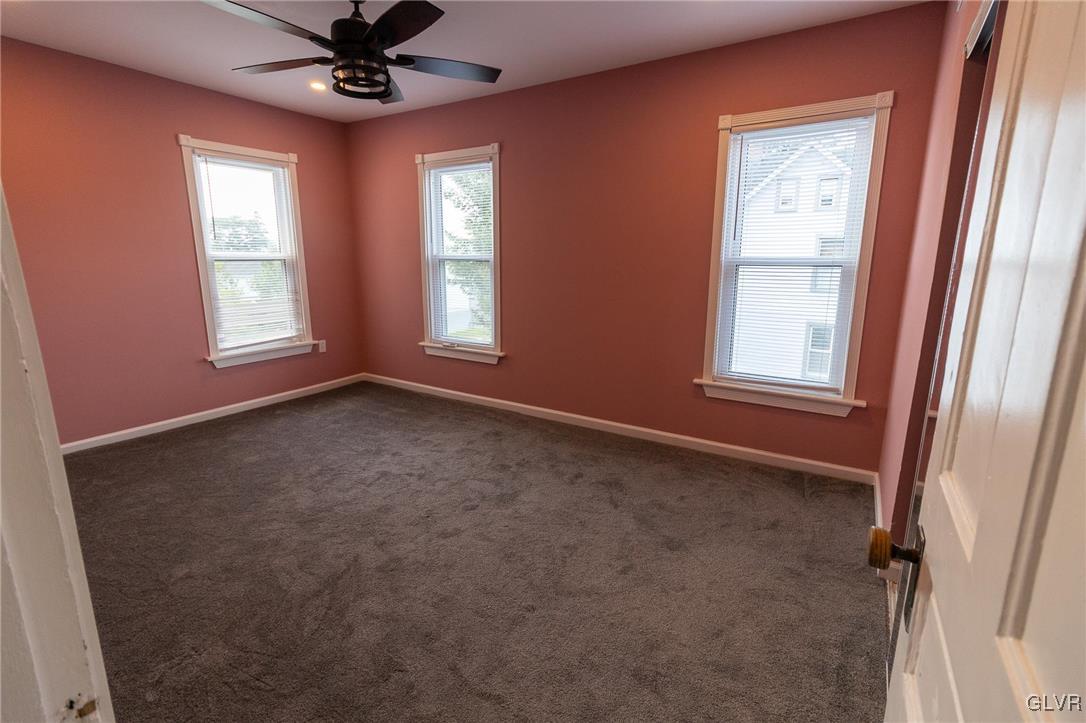 6366 Farm Bureau Road Allentown, PA 18106 - Photo 22 of 36 an empty room with windows and fan