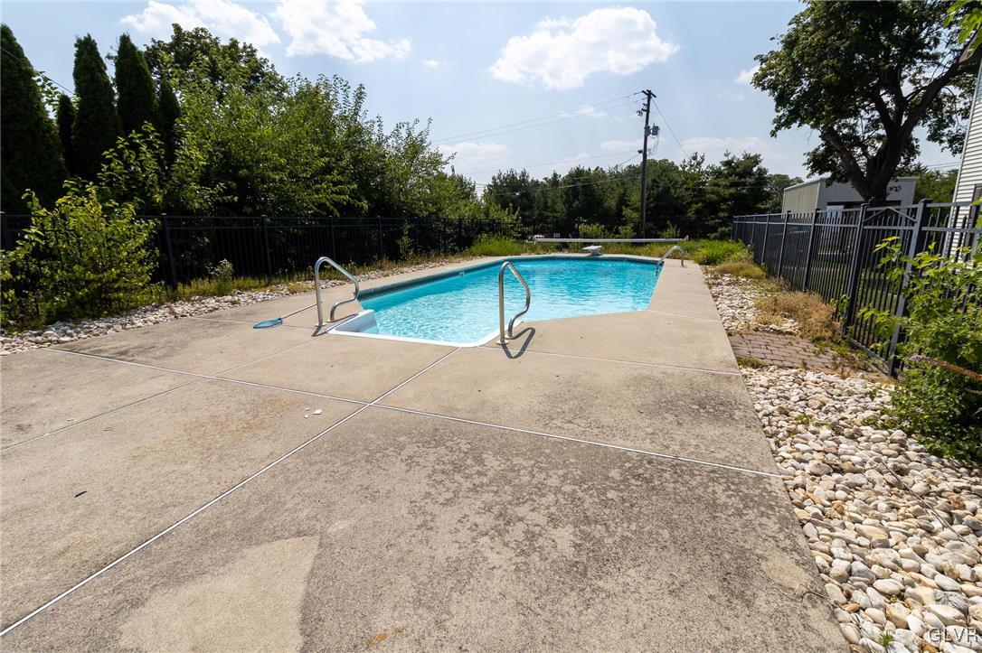 6366 Farm Bureau Road Allentown, PA 18106 - Photo 24 of 36 a view of a swimming pool with a patio and a yard
