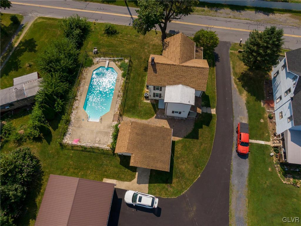 6366 Farm Bureau Road Allentown, PA 18106 - Photo 33 of 36 an aerial view of a house with a garden and pool
