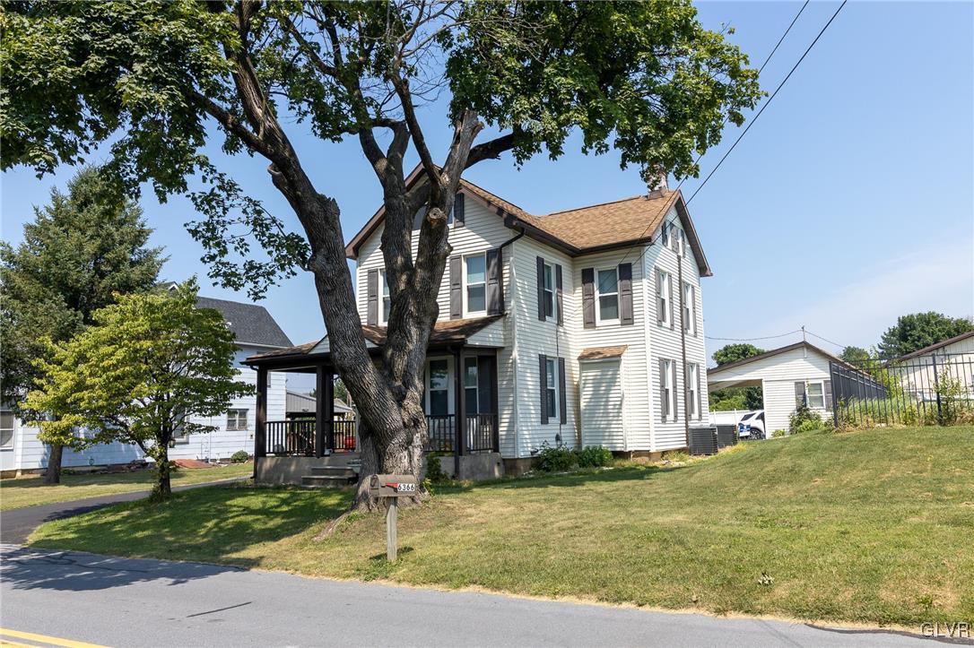 6366 Farm Bureau Road Allentown, PA 18106 - Photo 5 of 36 a front view of a house with garden