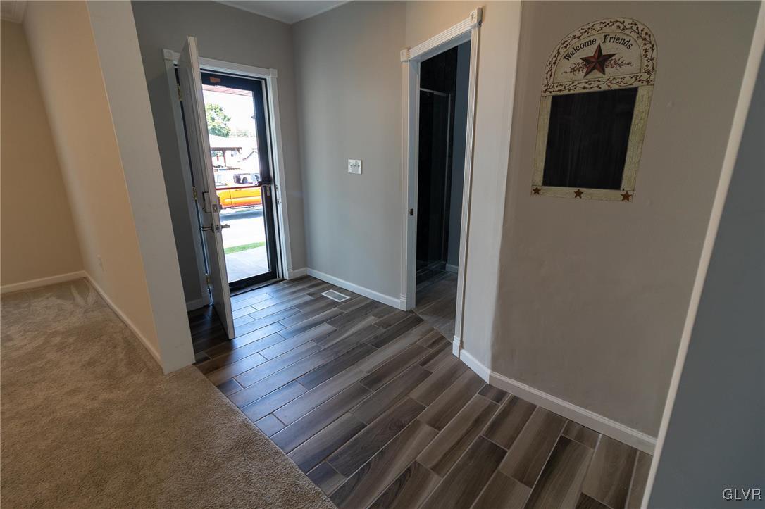 6366 Farm Bureau Road Allentown, PA 18106 - Photo 6 of 36 a view of hallway with wooden floor