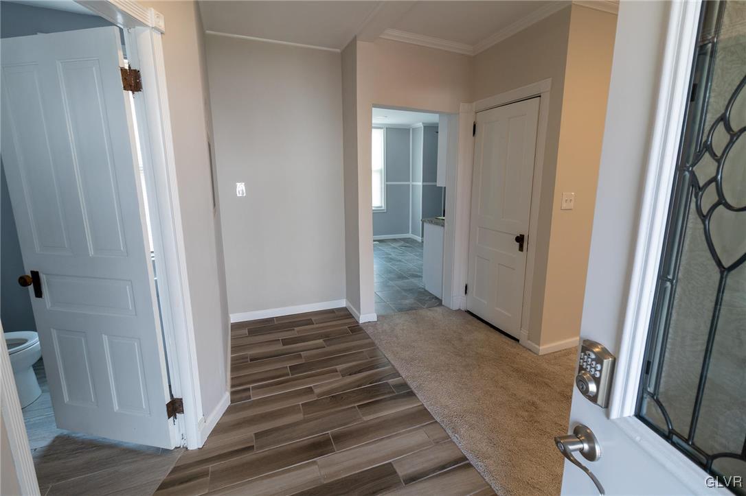 6366 Farm Bureau Road Allentown, PA 18106 - Photo 7 of 36 a view of a hallway with wooden floor and staircase