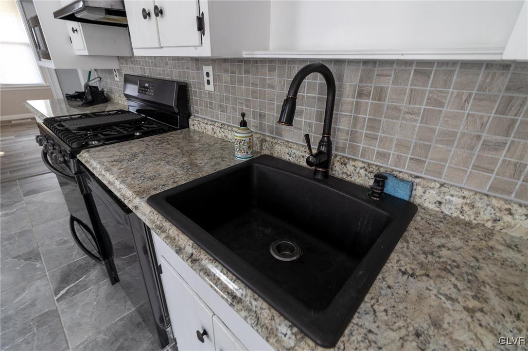 6366 Farm Bureau Road Allentown, PA 18106 - Photo 10 of 36 a kitchen with a stove and a sink