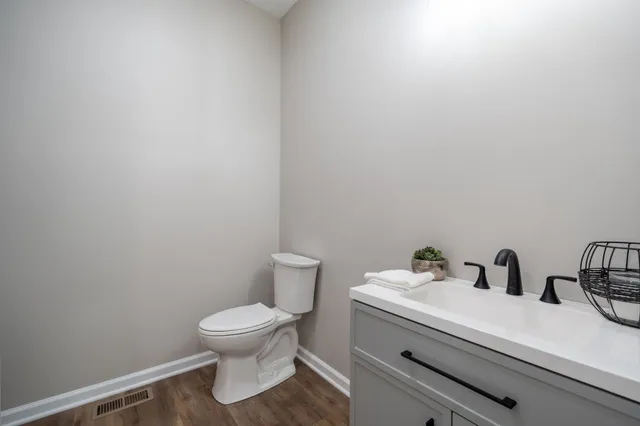 a bathroom with a toilet and a sink