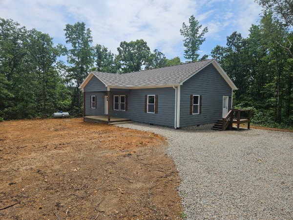 414 Edward Street Waynesboro, TN 38485 - Photo 3 of 17 a front view of a house with a garden