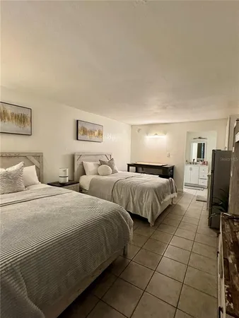 a bedroom with double bed and a flat screen tv