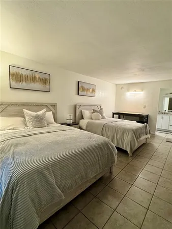 a bedroom with double bed and a night stand