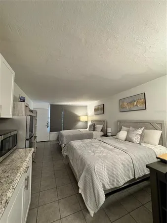 a bedroom with a bed and a stove top oven