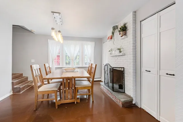 a dining room with furniture and wooden floor