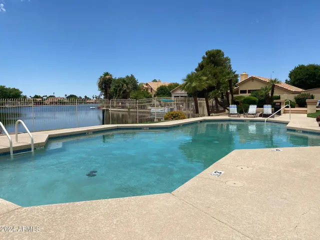 a view of a lake with a house in the background