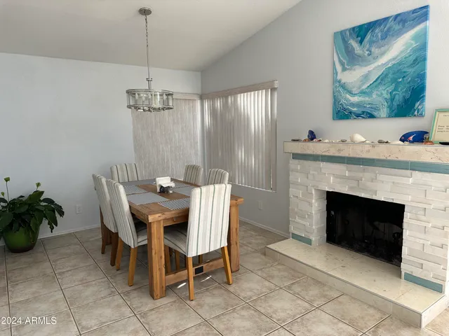 a view of a livingroom with furniture and a fireplace